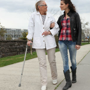 Elderly Lady Walking With A Young Woman